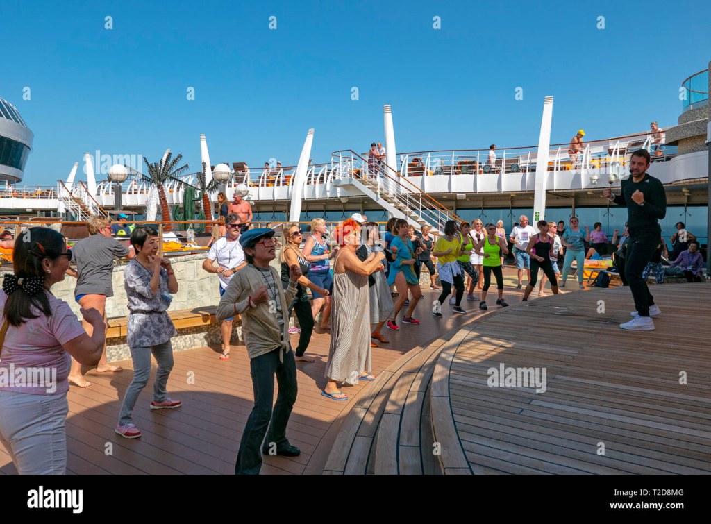 dancer on a cruise ship - Passengers dancing on the deck of a cruise ship following the lead